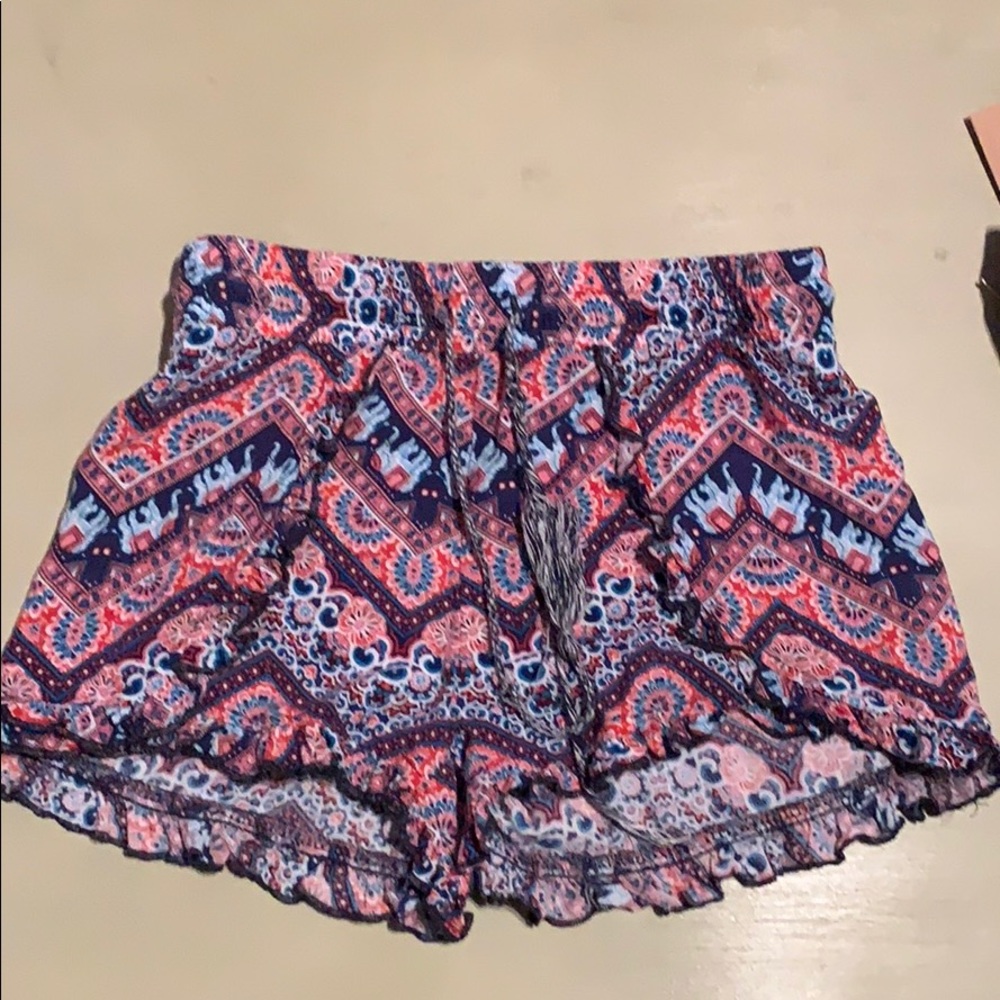 Red and blue printed elephant shorts.